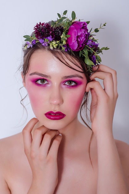 Portrait of a beautiful young girl with nude fashion bright make-up