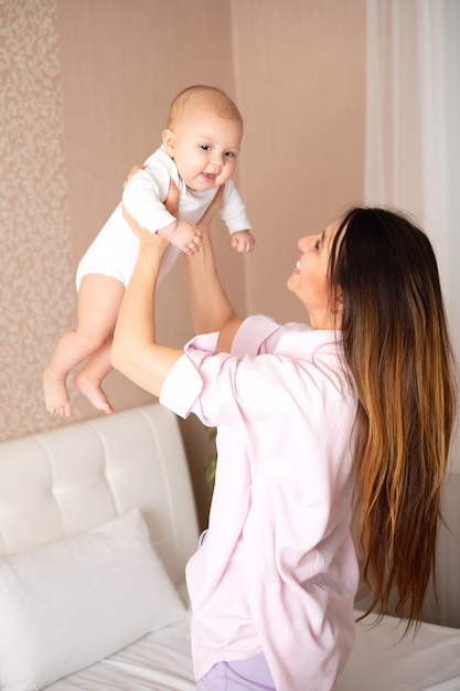 A portrait of a beautiful young mother and her sweet baby