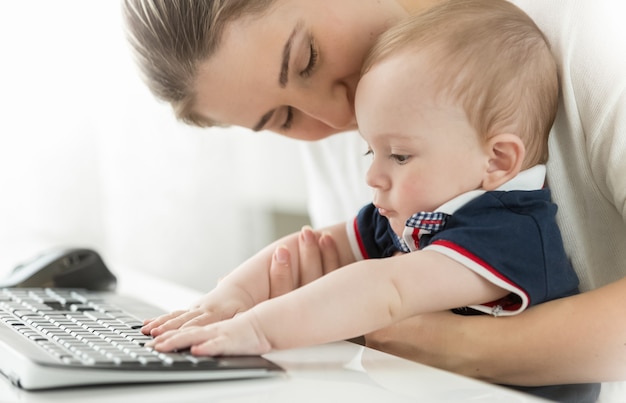 Portrait of beautiful young mother with her child