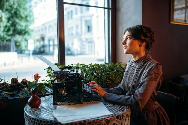 Portrait of beautiful young retro lady in cafe