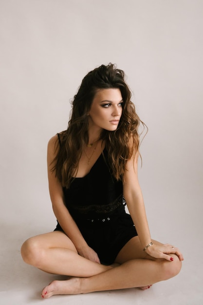 Portrait of a beautiful young sexy girl woman in a studio on a white background