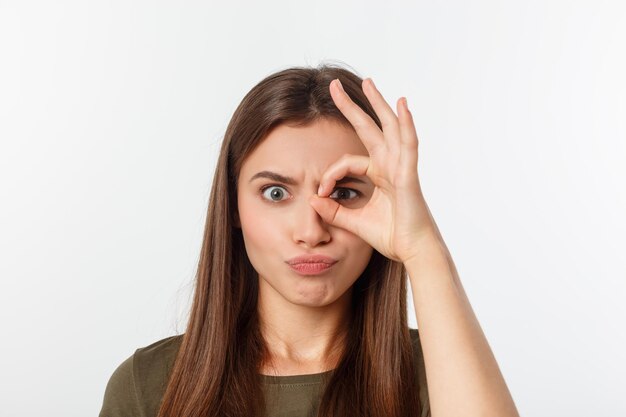 Portrait of beautiful young woman against white background