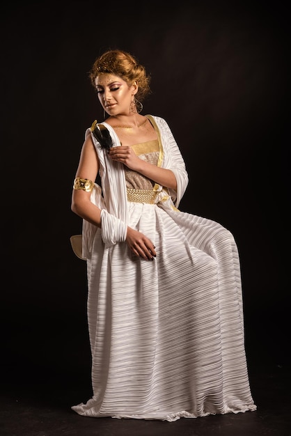 Portrait of a beautiful young woman over black background
