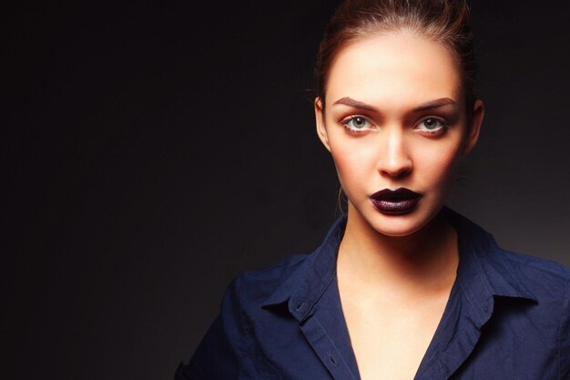 Portrait of beautiful young woman face Isolated on black background