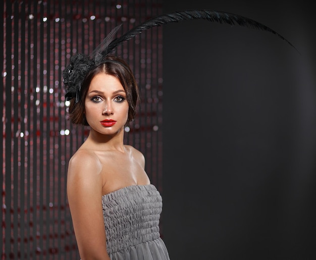 Portrait of beautiful young woman face Isolated on dark background