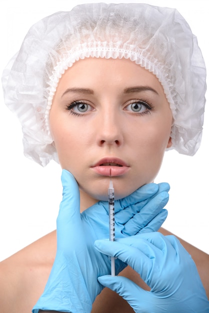 Portrait of beautiful young woman in medical headwear.