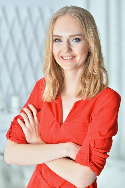 Portrait of beautiful young woman posing at home