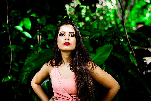 Portrait of beautiful young woman standing outdoors