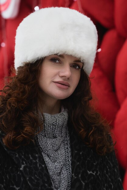 portrait of beautiful young woman on the street in winter