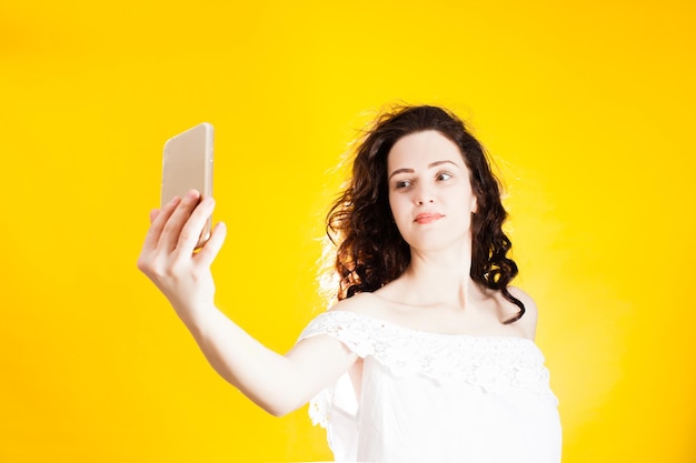 Portrait of beautiful young woman using smart phone
