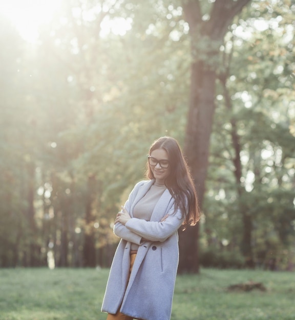 Portrait of a beautiful young woman wearing a coat outdoors