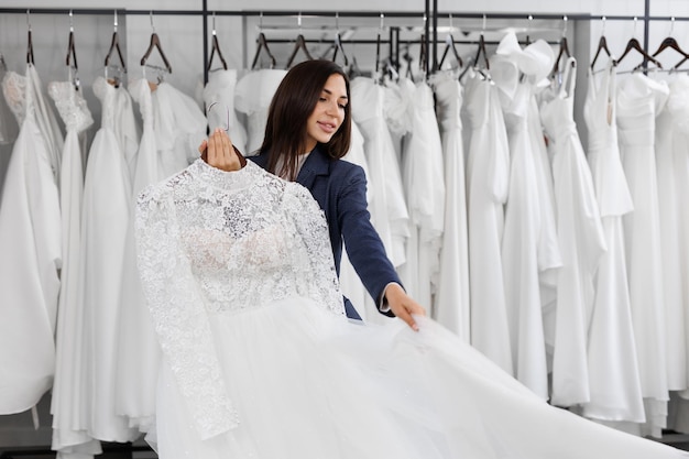 Portrait of a beautiful young woman in a wedding salon