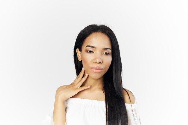 Portrait of a beautiful young woman over white background