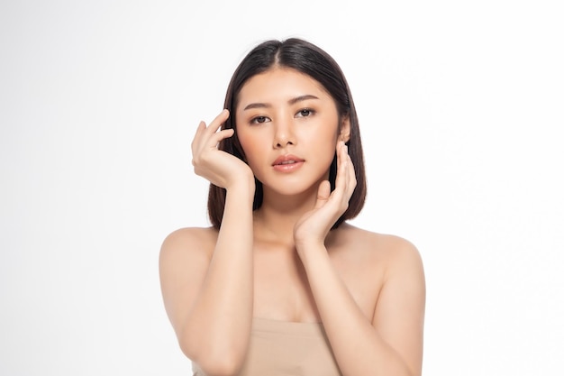 Portrait of beautiful young woman over white background