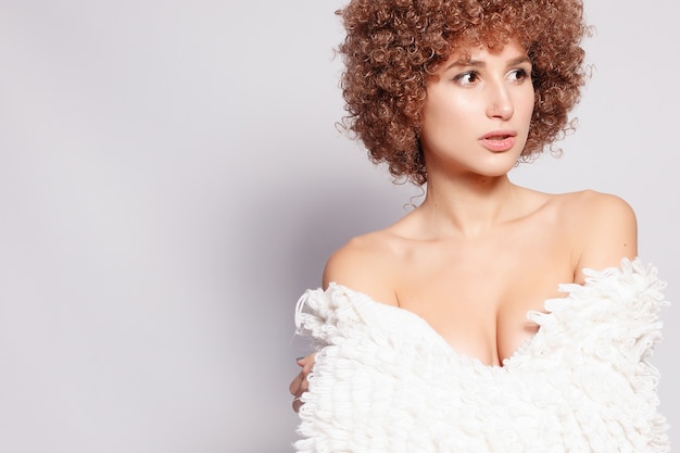 Portrait of a beautiful young woman with afro haircut