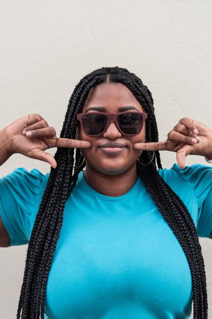 Portrait Of Beautiful Young Woman With Braid And Sunglasses