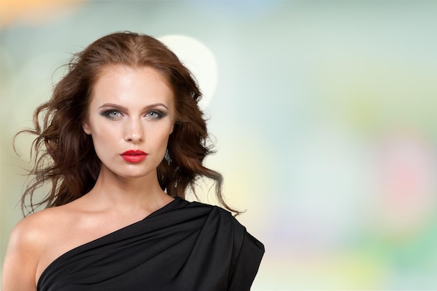 Portrait of beautiful young woman with  brown hair and  make-up