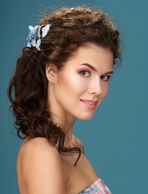 Portrait of Beautiful Young Woman with curly hair.