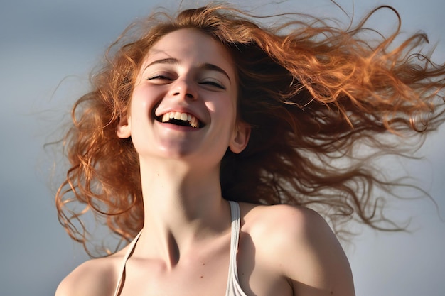 Portrait of a beautiful young woman with flying hair in the wind