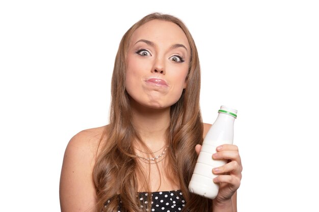 Portrait of a beautiful young woman with milk isolated