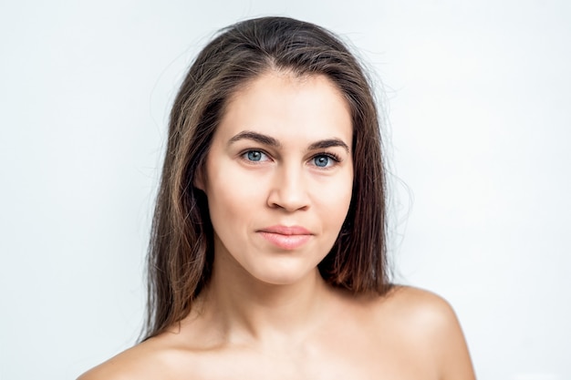 Portrait of beautiful young woman with natural makeup on her face.