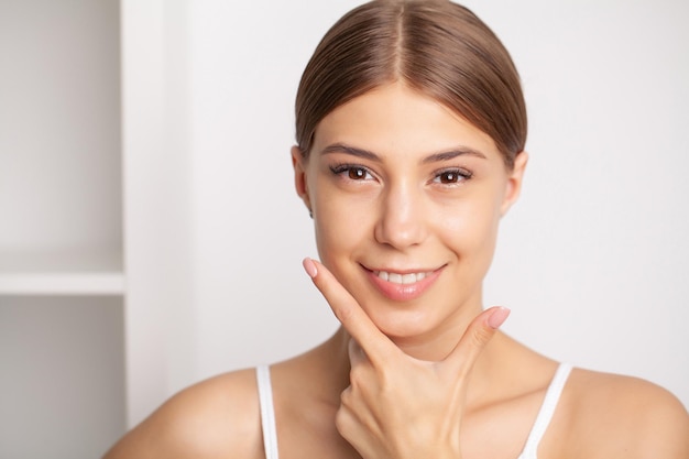 Portrait of beautiful young woman with perfect smile