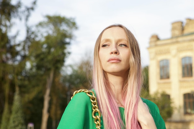 Portrait of a beautiful young woman with pink hair