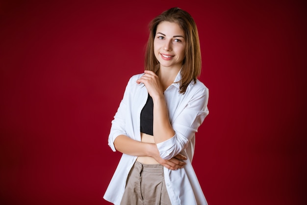 Portrait of a beautiful young woman with a press on the abdomen posing