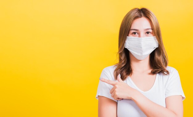 Portrait of a beautiful young woman over yellow background