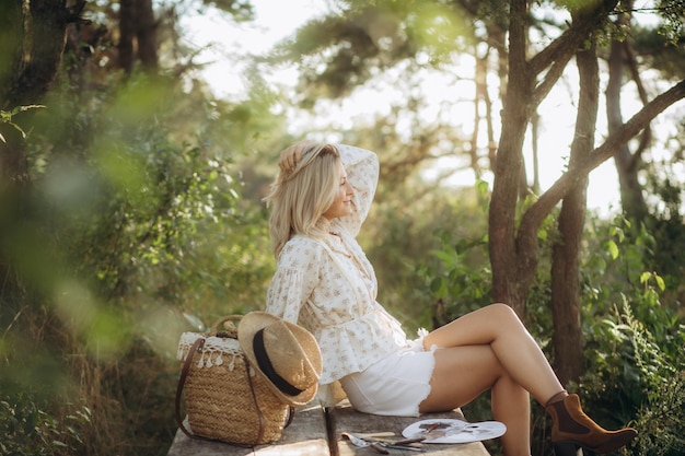 portrait of a beautifully dressed artist in nature