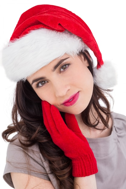 Portrait of a beauty brunette in santa hat