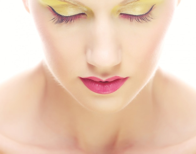 Portrait of beauty young girl with bright multicolored make-up. 