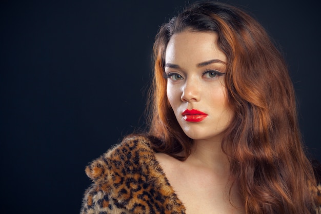 Portrait of beutiful girl isolated on dark background