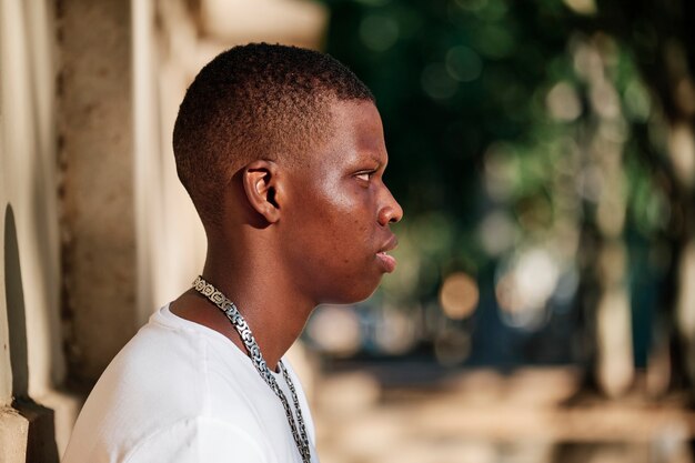 Portrait of a black boy in the city - concept portrait