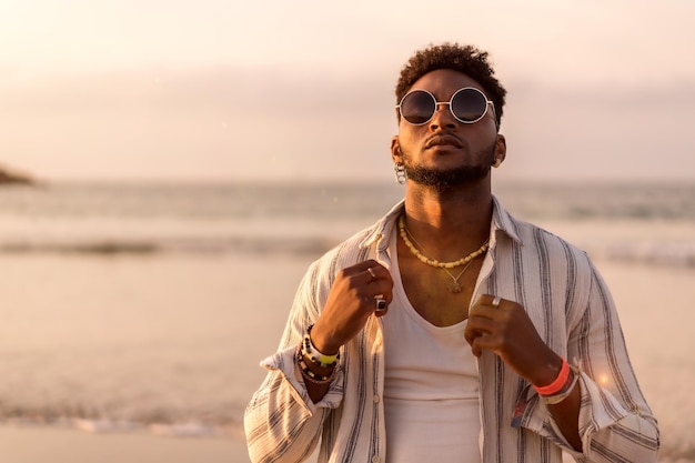 Portrait of black ethnic model enjoying summer vacation by the sea