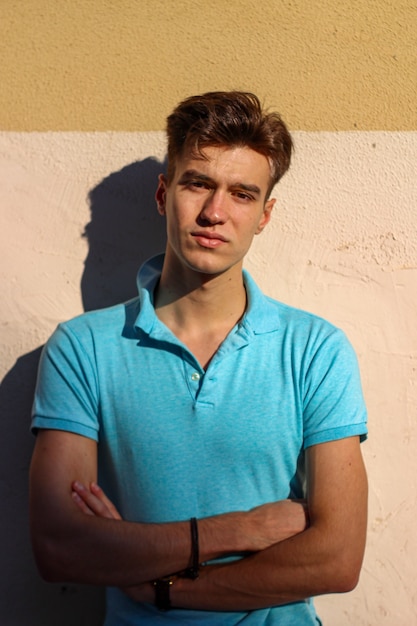 Portrait of blond guy looking at camera