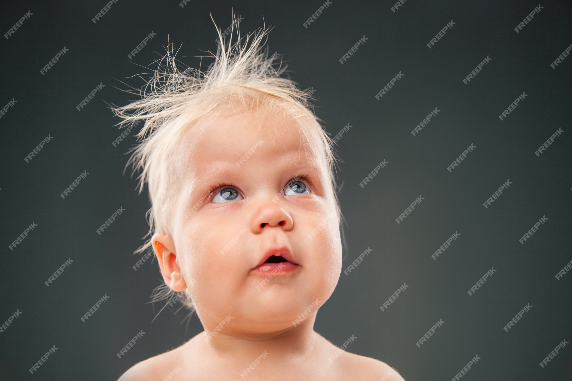 Premium Photo | Portrait of blonde baby with messy hair looking   shot