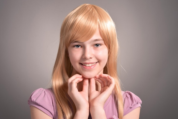 Portrait of blonde girl posing in studio