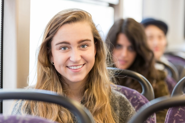 Portrait of a blonde woman on a bus