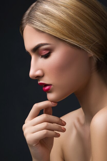 Portrait of blonde woman with red lips