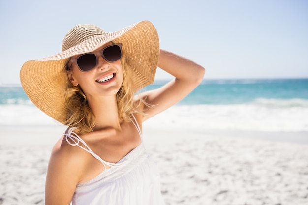 Portrait of blonde woman with straw hat