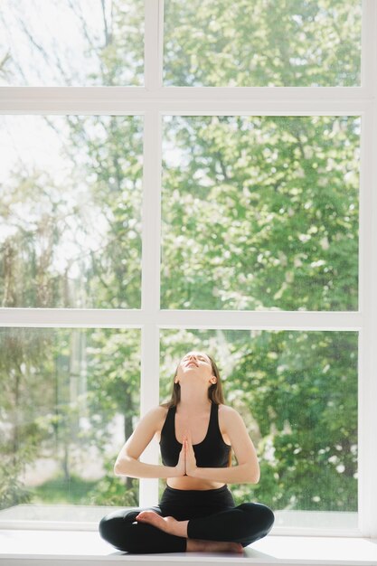 Portrait of body fitness trainer lady relaxing between exercise\
on gym