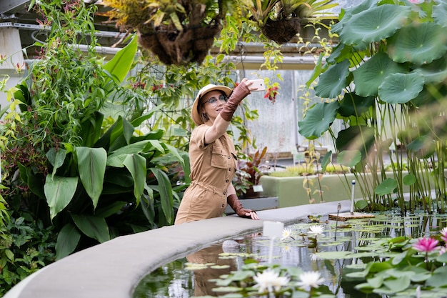 Portrait of botanist woman in greenhouse