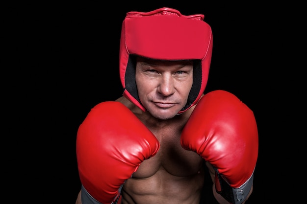 Portrait of boxer with gloves and headgear