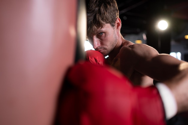 Photo portrait of boxers must practice their kicking and punching skills with punching bag to build strength and power of kicking and punching