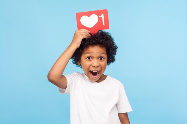 Portrait of boy against blue background