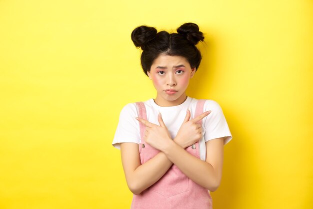 Photo portrait of a boy against yellow background