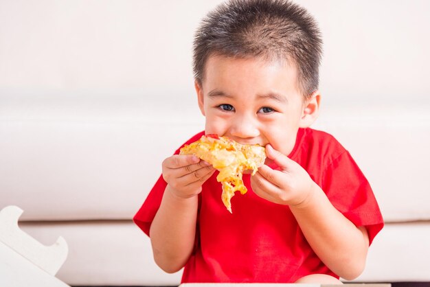 Portrait of boy eating food