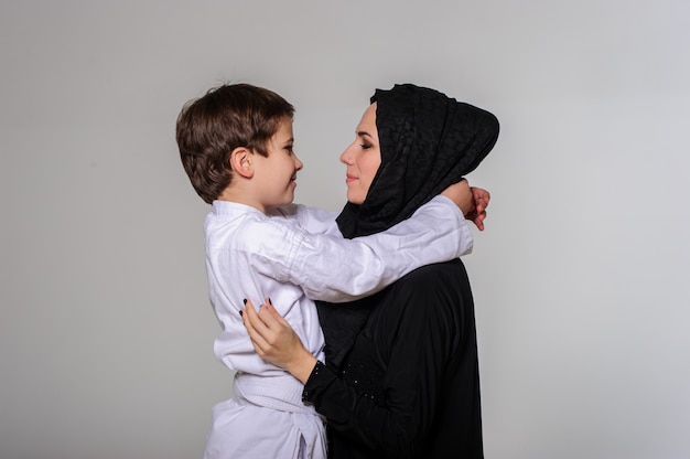 Portrait of a boy embracing his mother