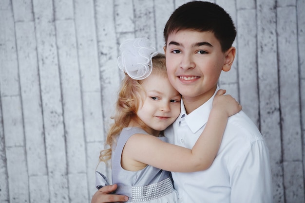 Portrait of a boy and girl. Brother and younger sister.